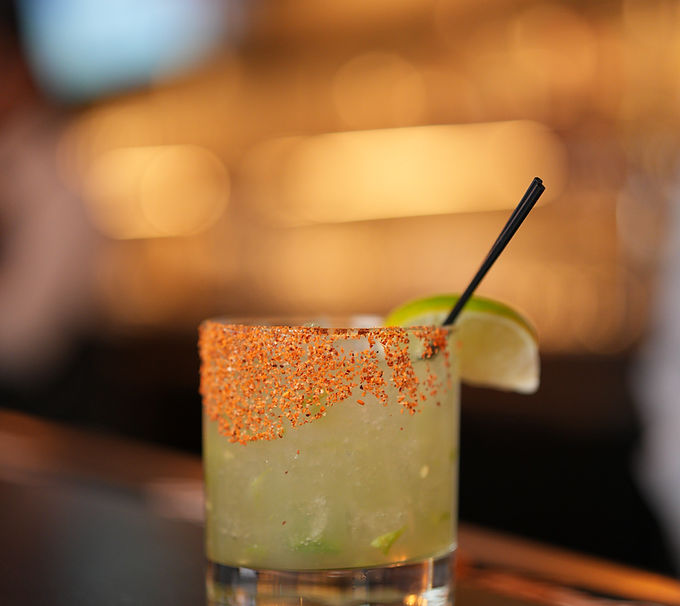 Garnished cocktail on a bar counter
