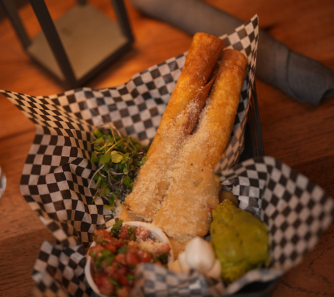 Delicious wrapped taquitos served with salsa and guacamole.